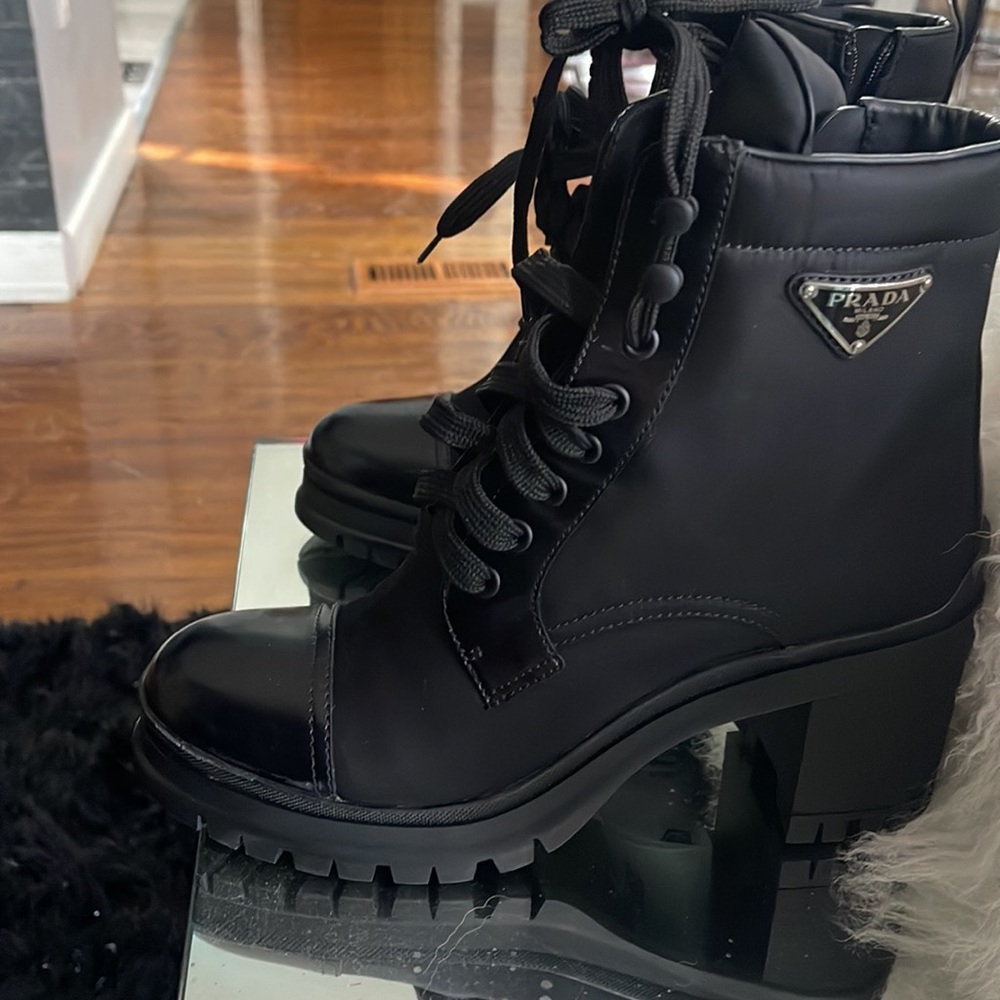 Black like new Prada boots in excellent condition. They were worn for half day.